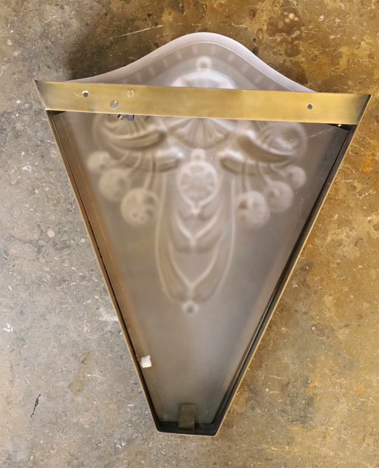 An Art Deco bronzed metal and frosted glass up lighter wall light, height 34cm. width 27cm